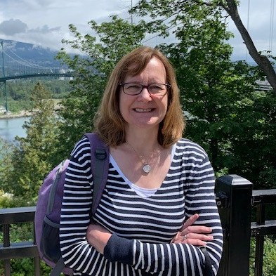 Susan, Head of Education & Learning, outside with a backpack