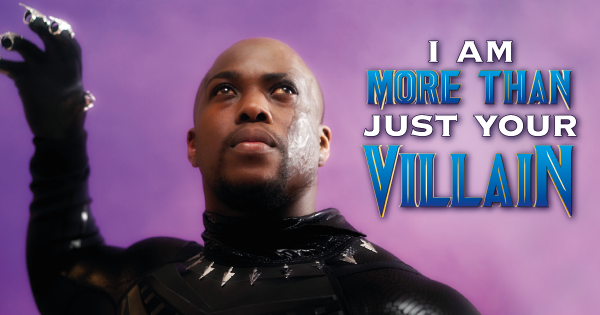 A person with a visible difference dressed as T'Challa from Black Panther, with the text "I am more than just your villain"