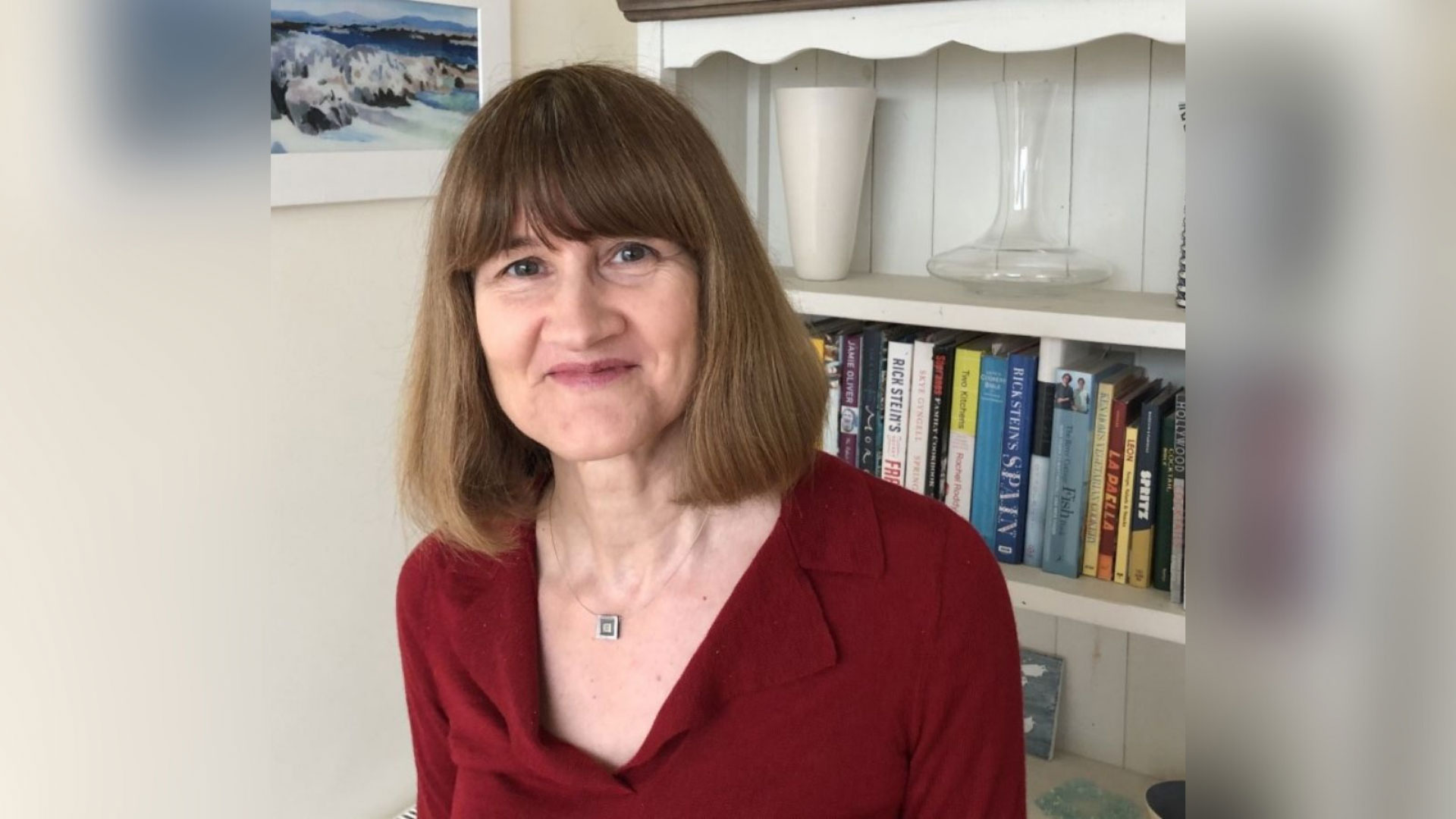 CEO Heather Blake wears a red top and has short brown hair with a fringe