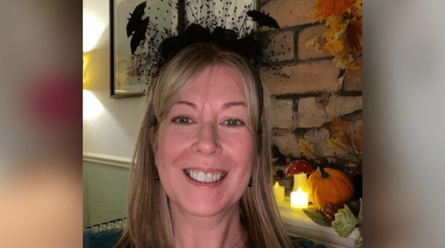 Wellbeing Practitioner Julie wearing a Halloween headband with bats on it