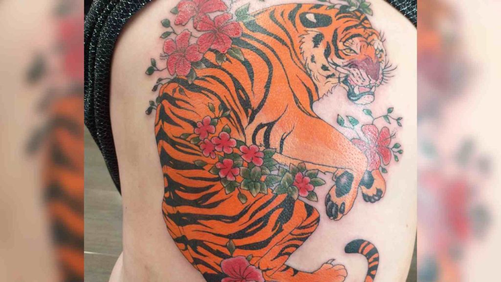 Large tiger tattoo covers woman's back