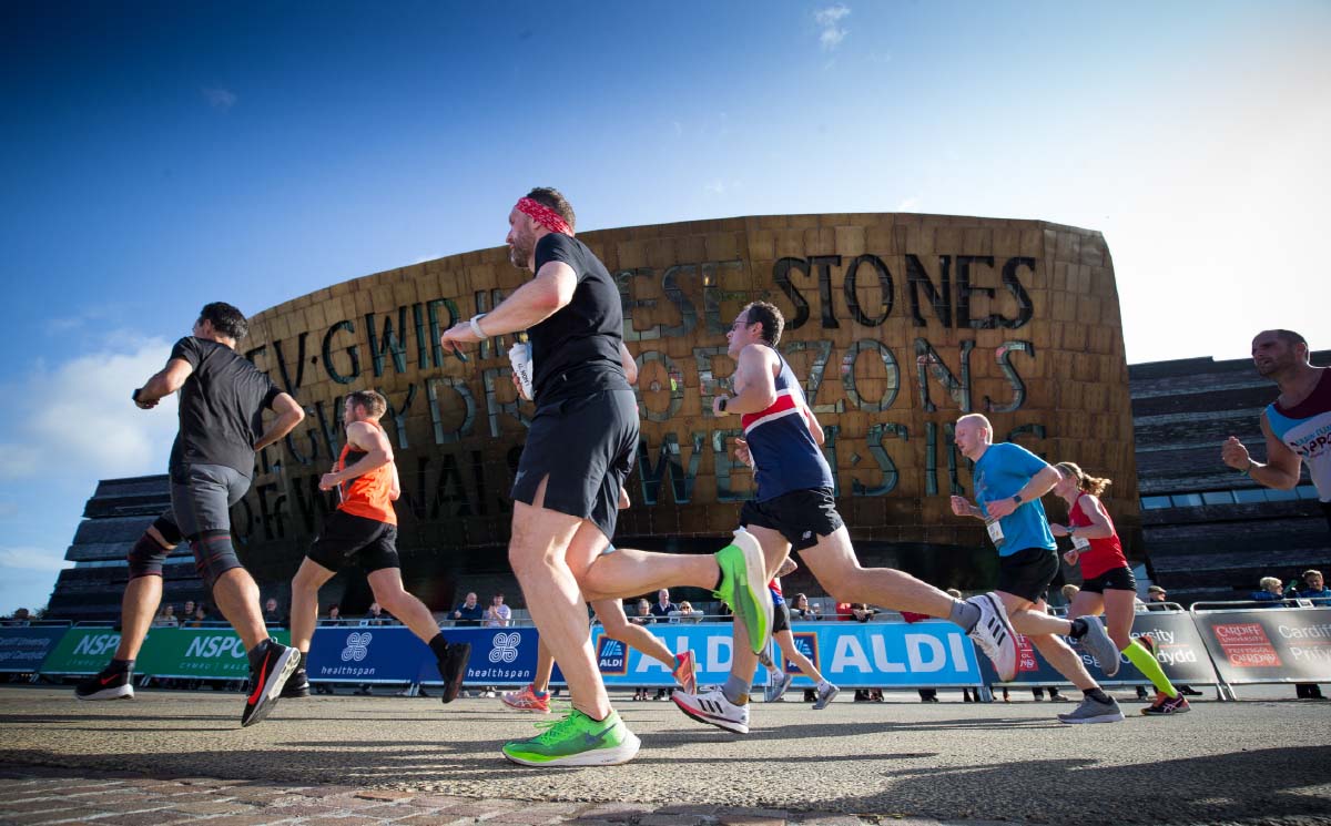 Cardiff half marathon runners going passed the Senedd