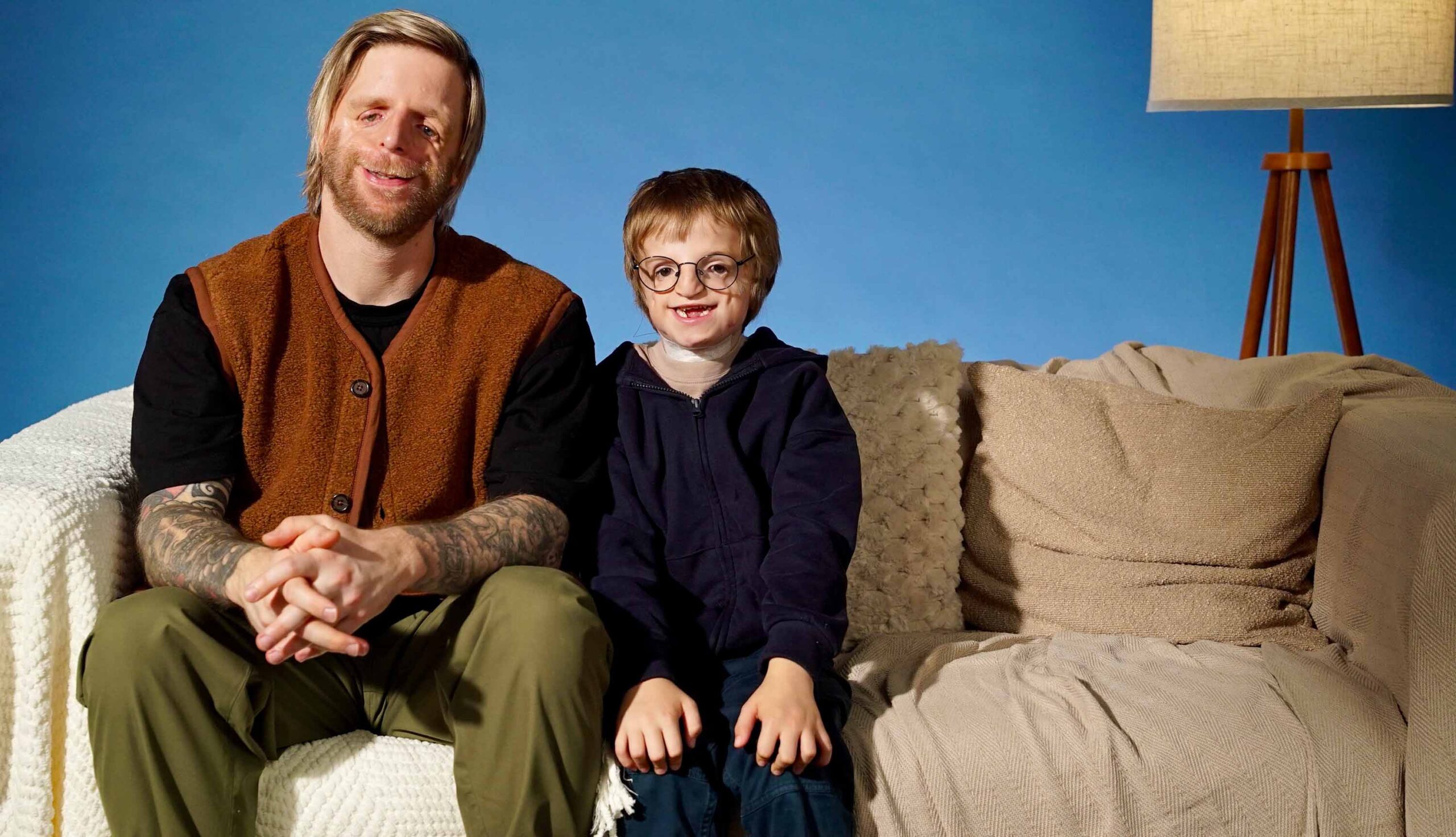 Jono Lancaster and William sat on the Changing Faces sofa