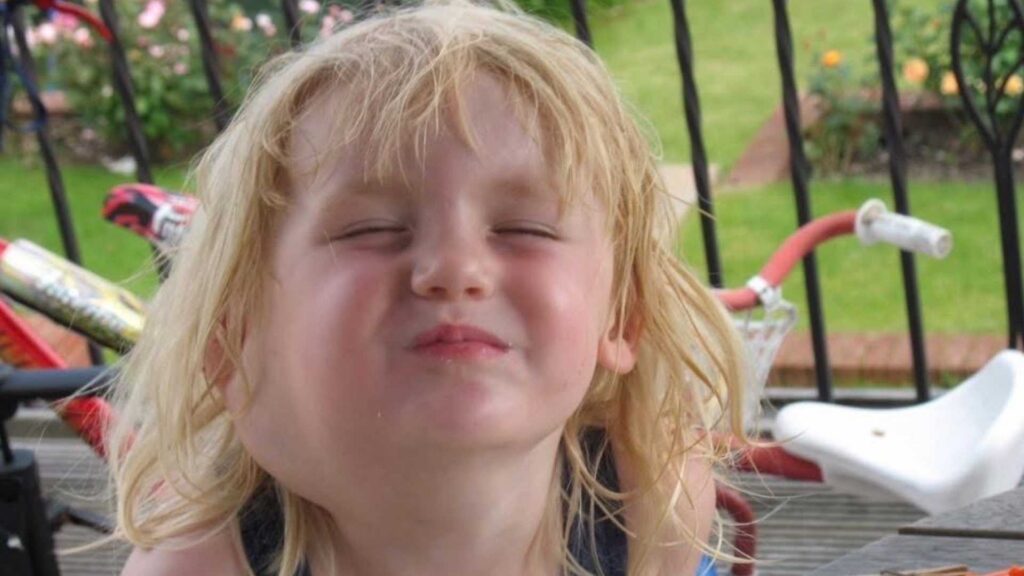 Abi as a child. Her lymphatic malformation is visible on the side of her face.