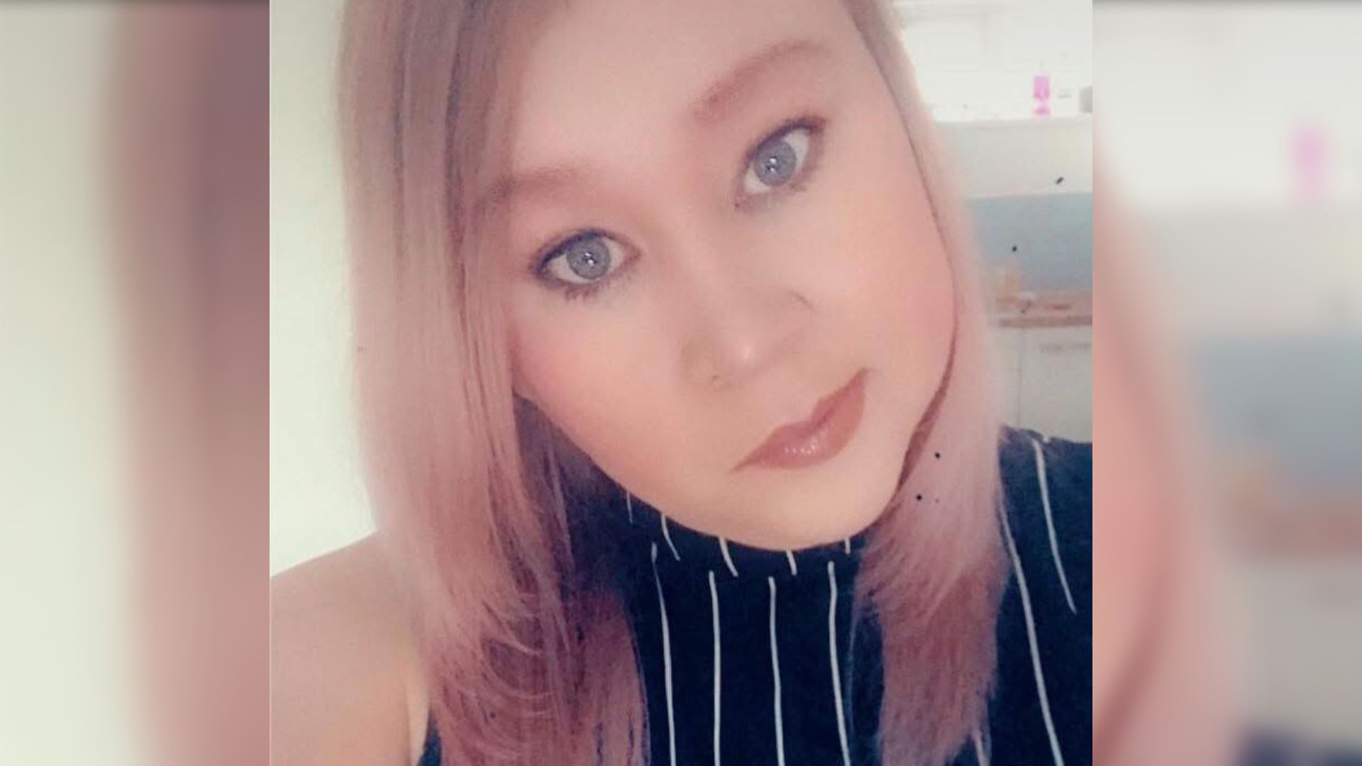 A selfie of Leah who has functional neurological disorder, resulting in facial paralysis.