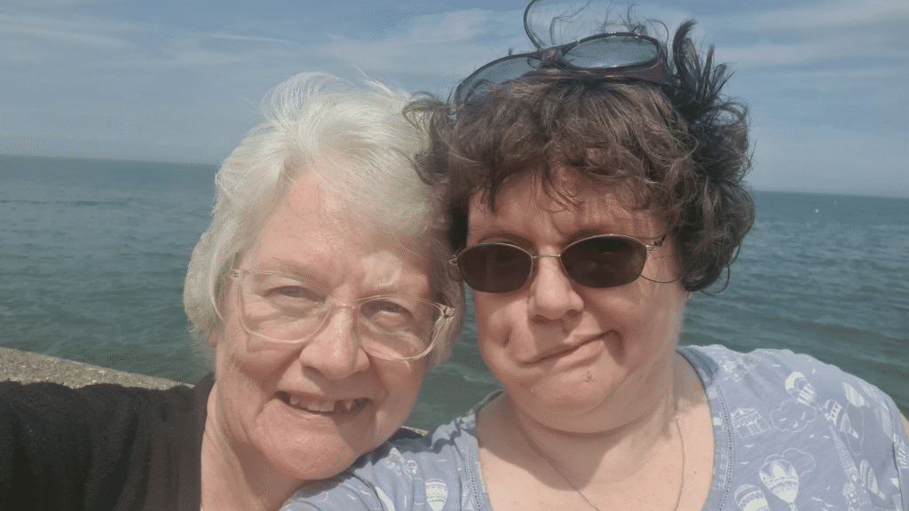 A selfie of Angela and her mum at the seaside.