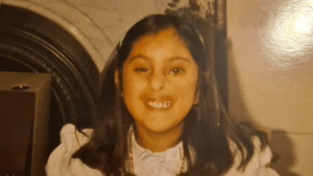 Shabana as a child. She smiles brightly at the camera.